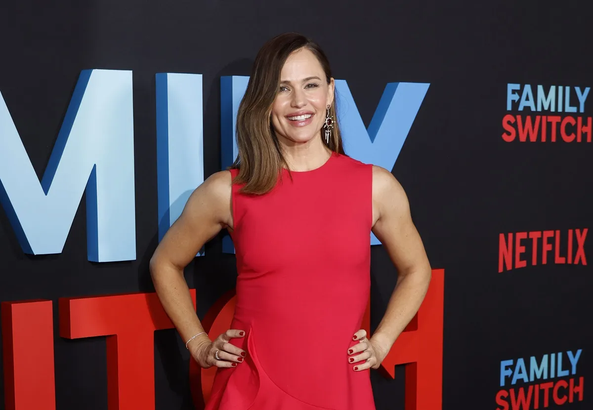 Jennifer Garner posing in a red dress at the premiere of Netflix's "Family Switch".