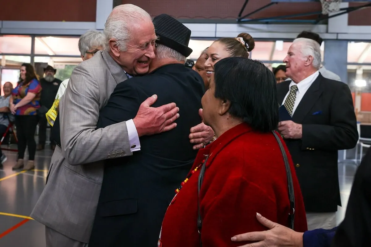 King Charles III receives a hug during a visit to the National Centre of Indigenous Excellence in Sydney