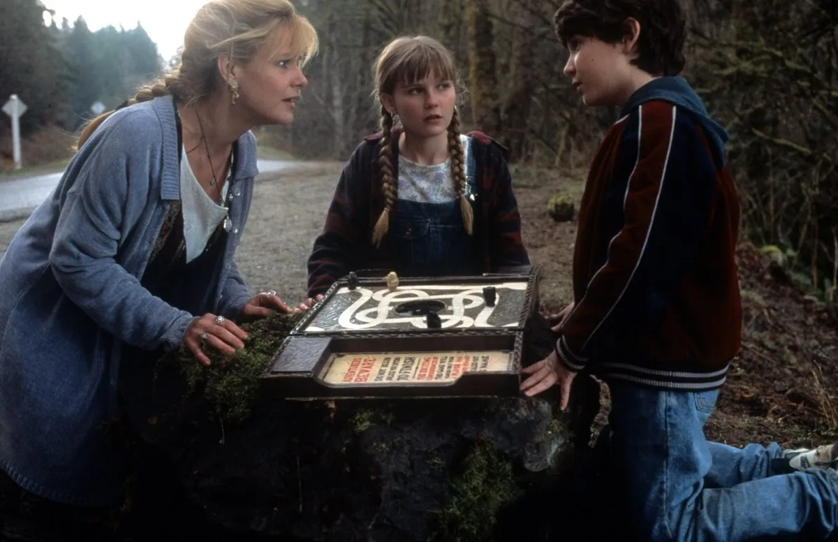 Kirsten Dunst with Bonnie Hunt and Bradley Pierce in a scene from 'Jumanji'.