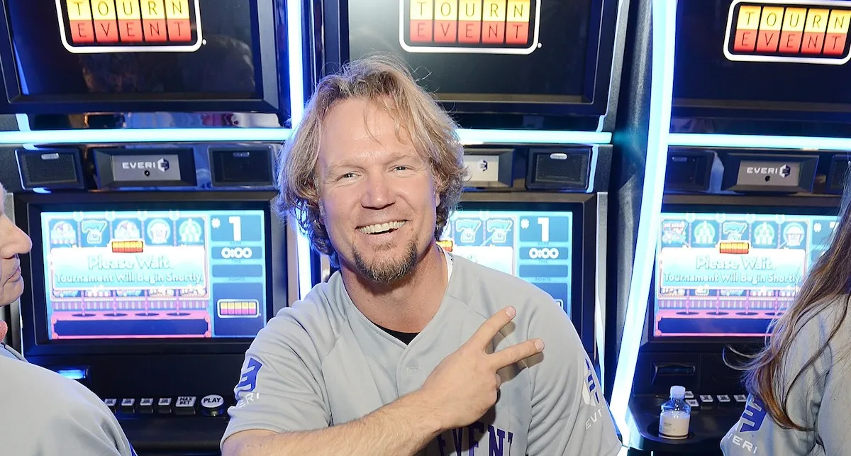 Kody Brown sitting in front of slot machines