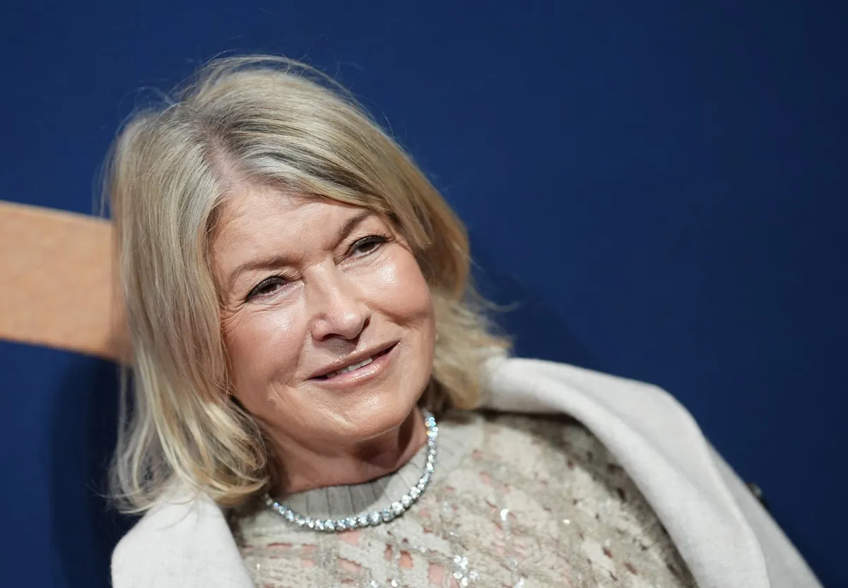 Martha Stewart posing at the 2024 WWD Honors at Cipriani South Street in an all white outfit.