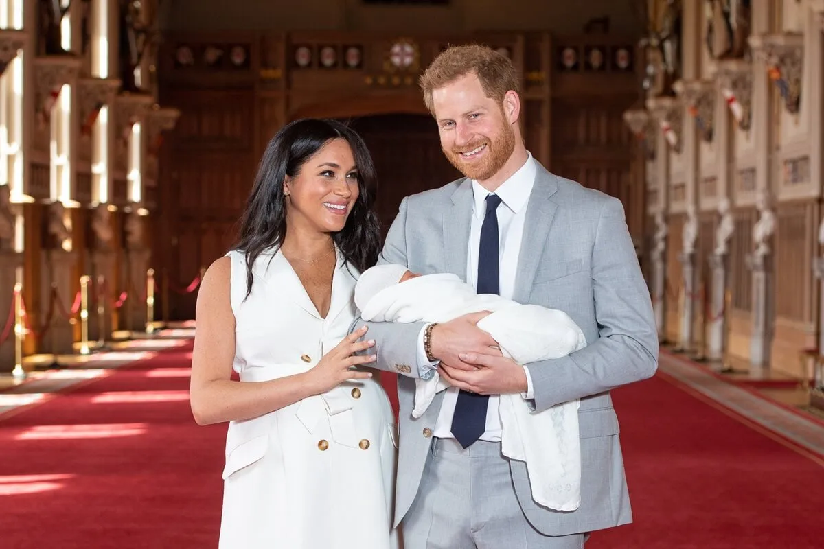 Meghan Markle and Prince Harry pose with their newborn son, Archie, during a photocall at Windsor Castle