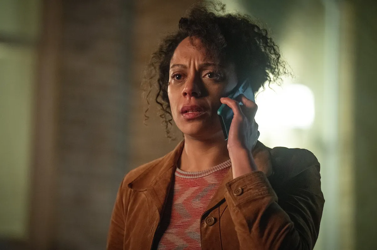 Confused woman holding a cellphone to her ear in Netflix's 'Missing You'