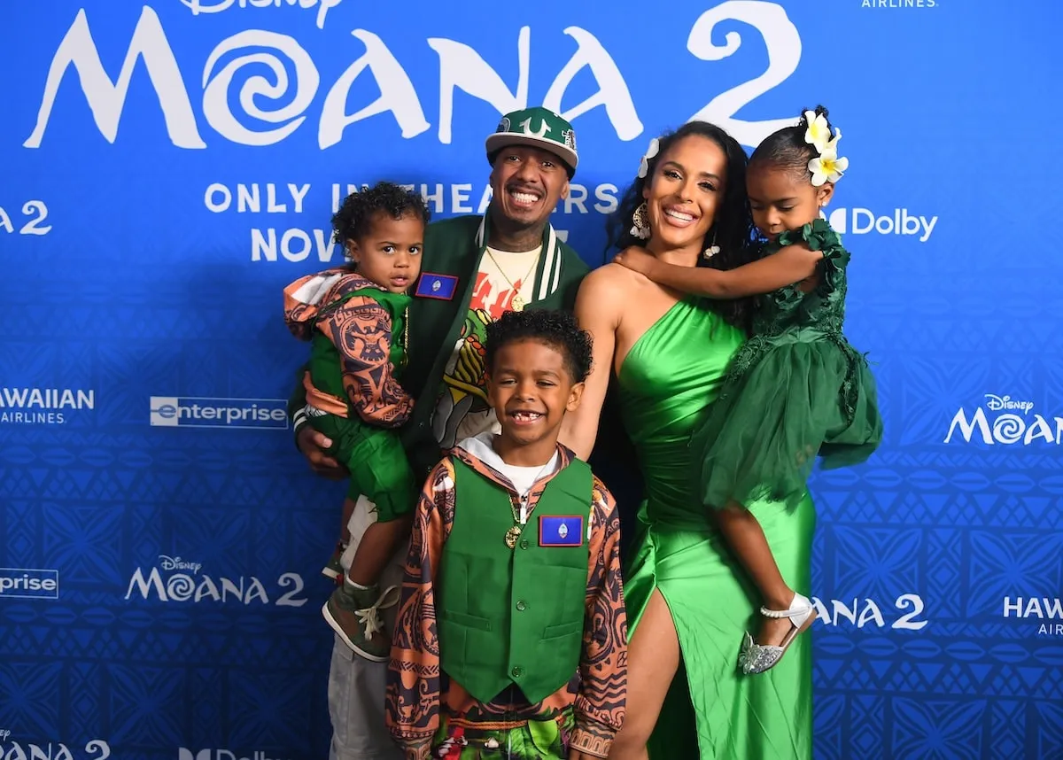 Nick Cannon stands with former partner Brittany Bell and their three children at the Moana 2 premiere