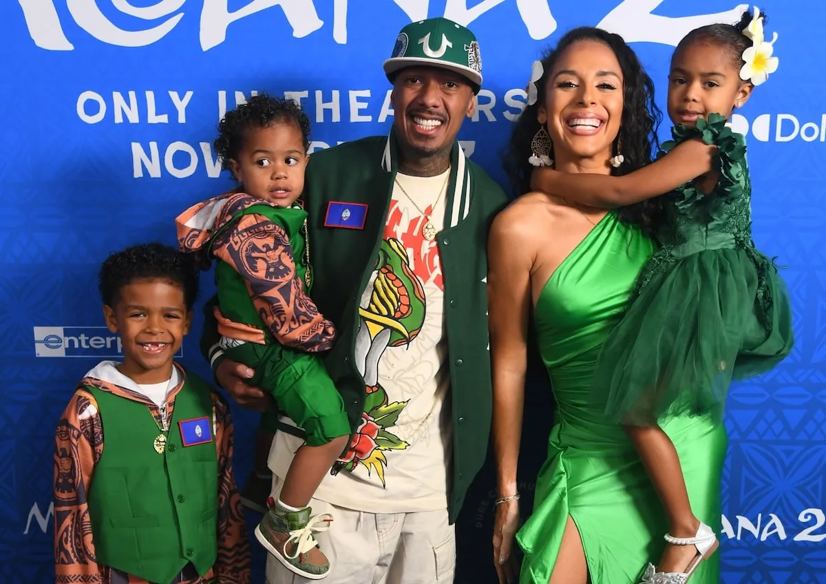 Nick Cannon stands with former partner Brittany Bell and their three children at the Moana 2 premiere