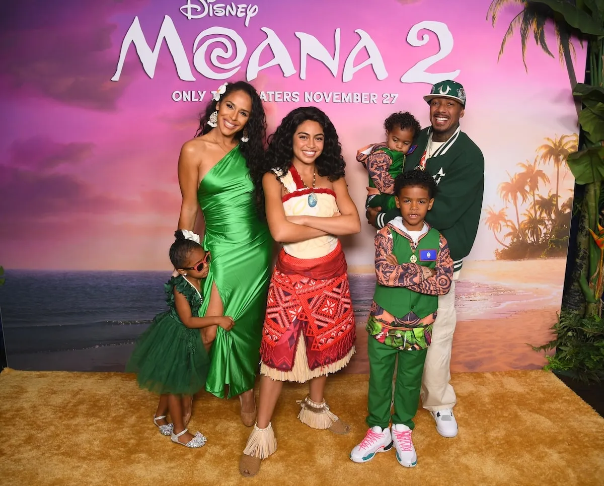 Nick Cannon stands with former partner Brittany Bell and their three children at the Moana 2 premiere