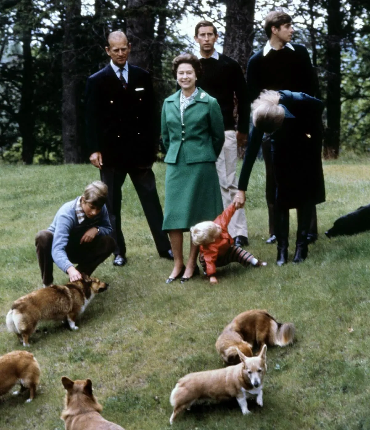 Queen Elizabeth II, Prince Philip, and their family pose with the royal corgis