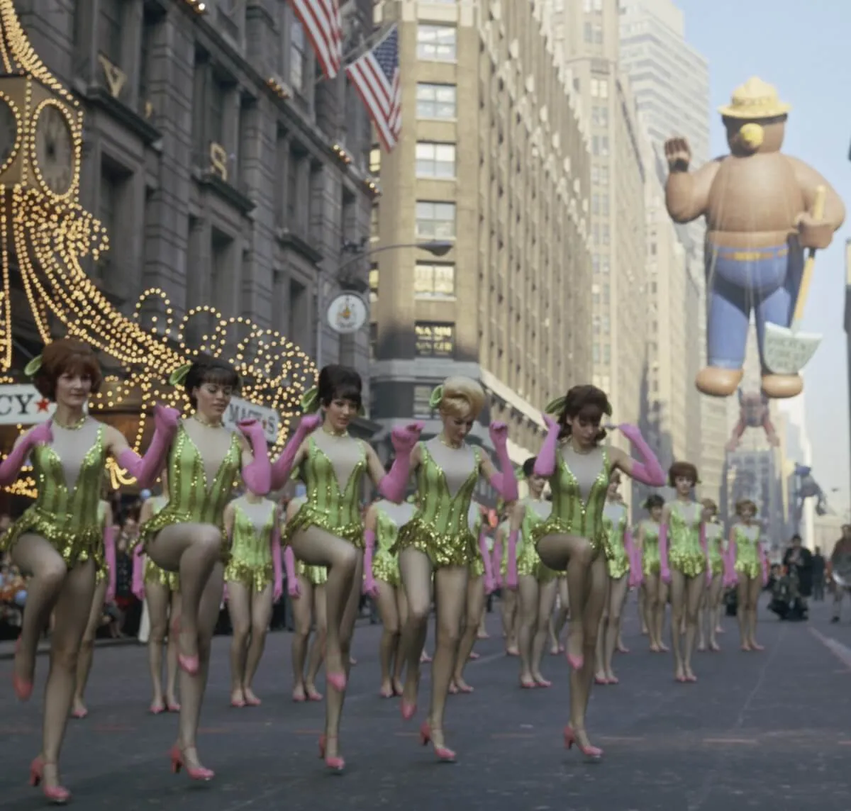 Members of the Rockettes perform in lime green costumes during the 1966 Macy's Thanksgiving Day Parade