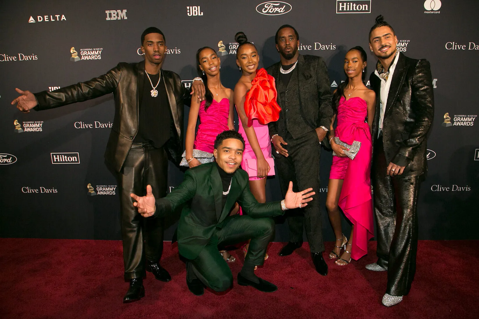 Justin Dior Combs, Sean 'Diddy' Combs, Christian 'King' Combs, Quincy Taylor Brown, D'Lila Combs, Jessie Combs, and Chance Combs posing together at a Grammy event in 2020