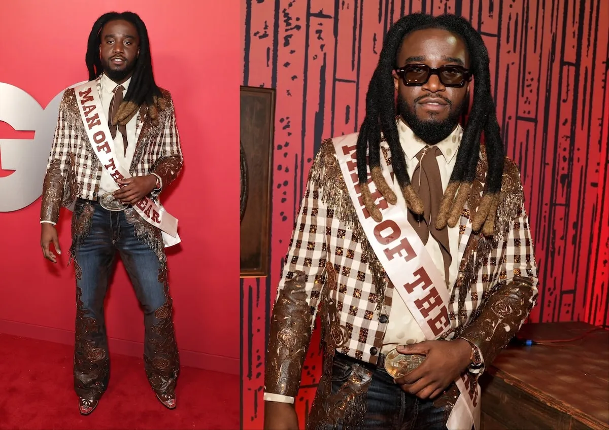 Wearing a plaid suit coat and Western jeans and boots, Shaboozey poses for photos on the red carpet at the 2024 GQ Men Of The Year Party