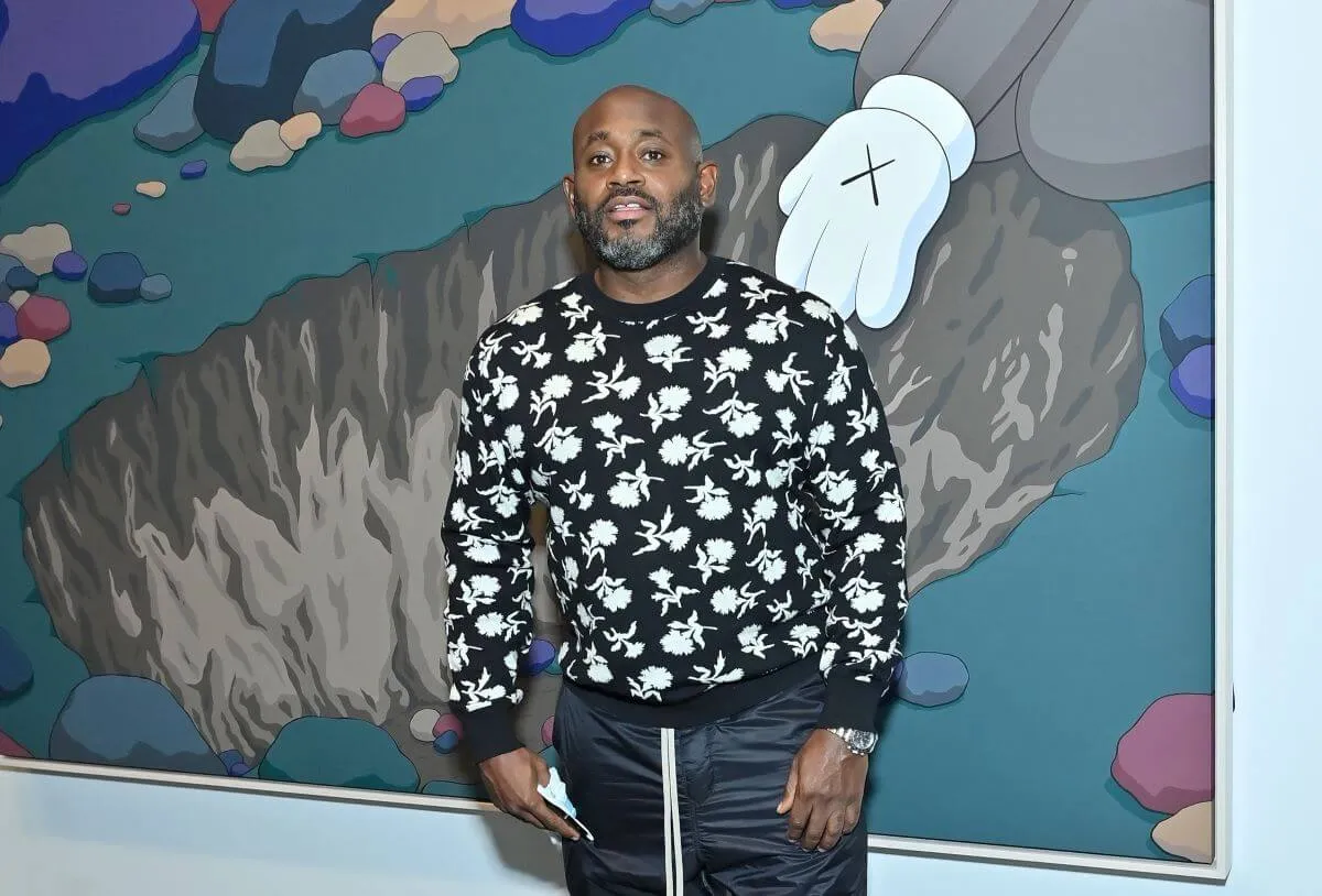 Steve Stoute wears a black sweatshirt with floral pattern.