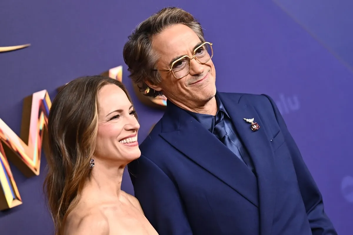 Susan Levin and Robert Downey Jr posing at the Primetime Emmy Awards.