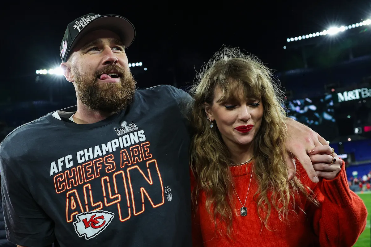 Travis Kelce and Taylor Swift arm in arm after a Kansas City Chiefs game