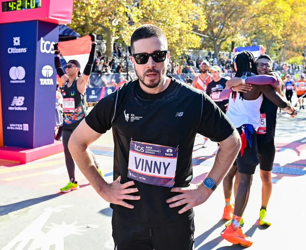 Vinny Guadagnino with his hands on hips at the NYC Marathon finish line