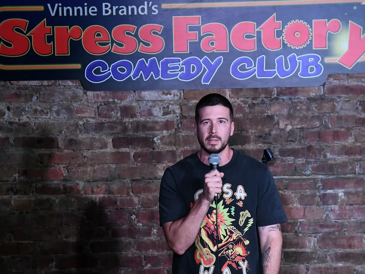 Vinny Guadagnino of 'Jersey Shore' holding a microphone at a comedy club