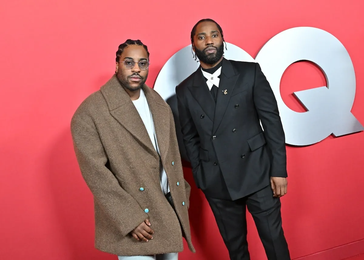 Brothers Malcolm Washington and John David Washington pose for photos on the red carpet at the 2024 GQ Men Of The Year Party