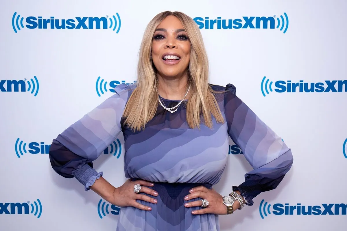 Wendy Williams visits SiriusXM Studios on September 6, 2018 while posing and wearing a blue dress.