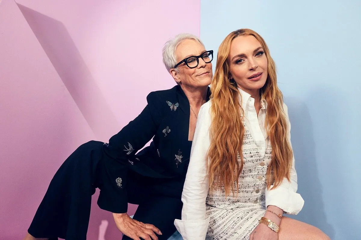 Jamie Lee Curtis and Lindsay Lohan pose in the IMDb Official Portrait Studio at D23 2024.