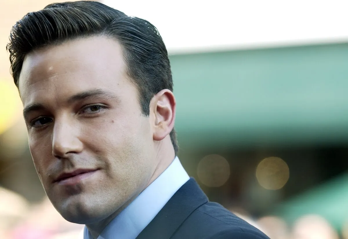 Ben Affleck posing at the premiere of 'Gigli' in a suit.