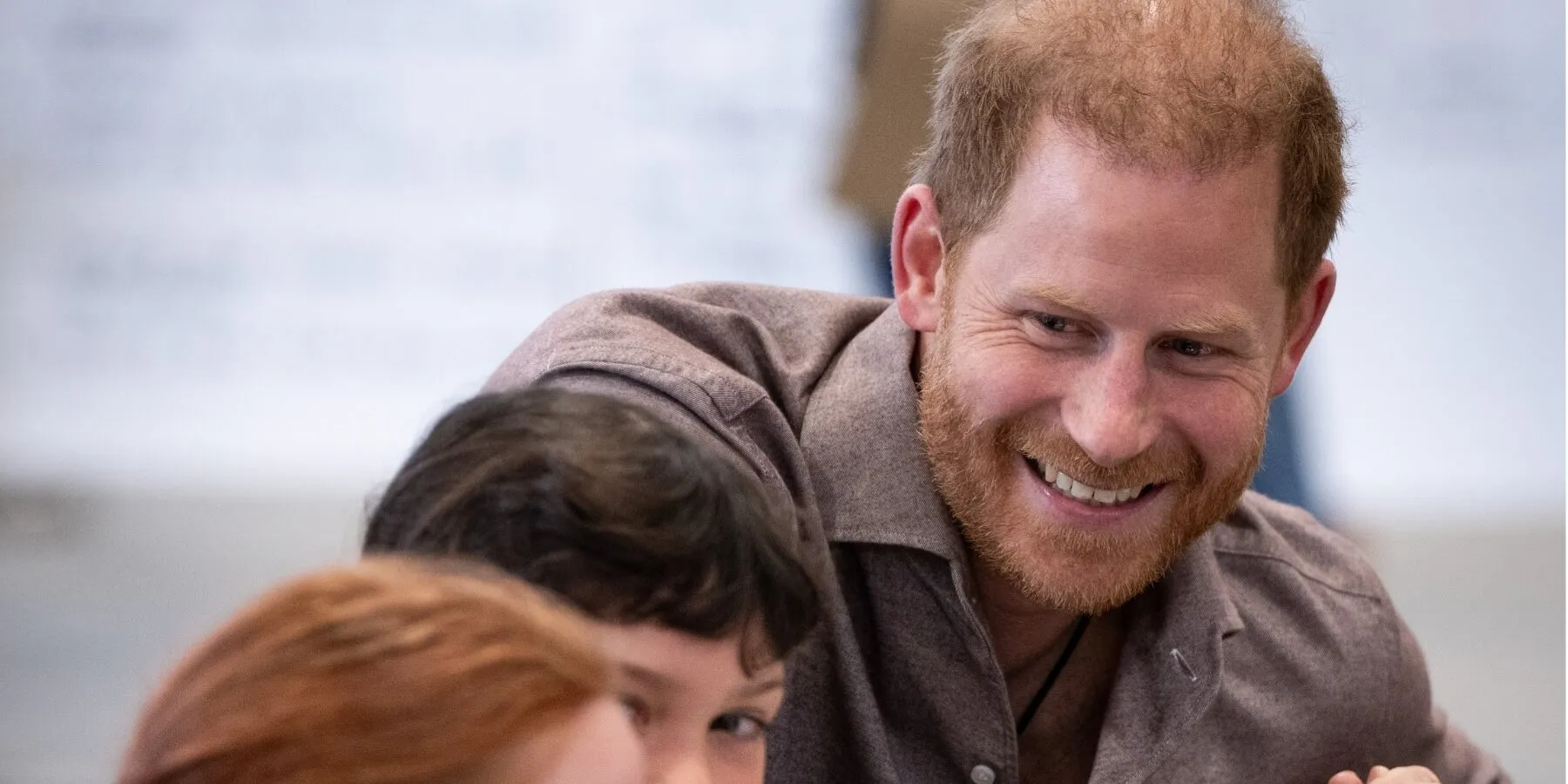 Prince Harry beaming during an Invictus Games event.