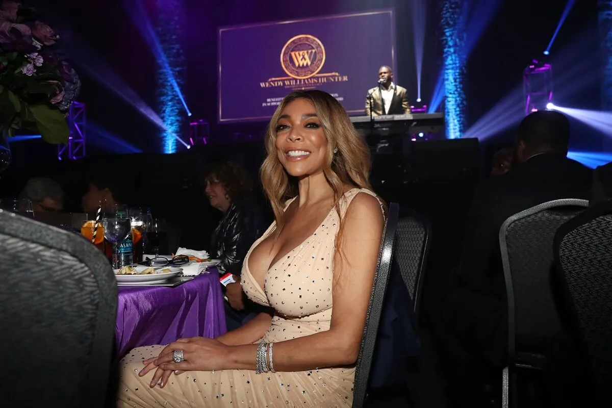 Wendy Williams attends the Wendy Williams Hunter Birthday Give Back Gala while wearing a yellow dress.