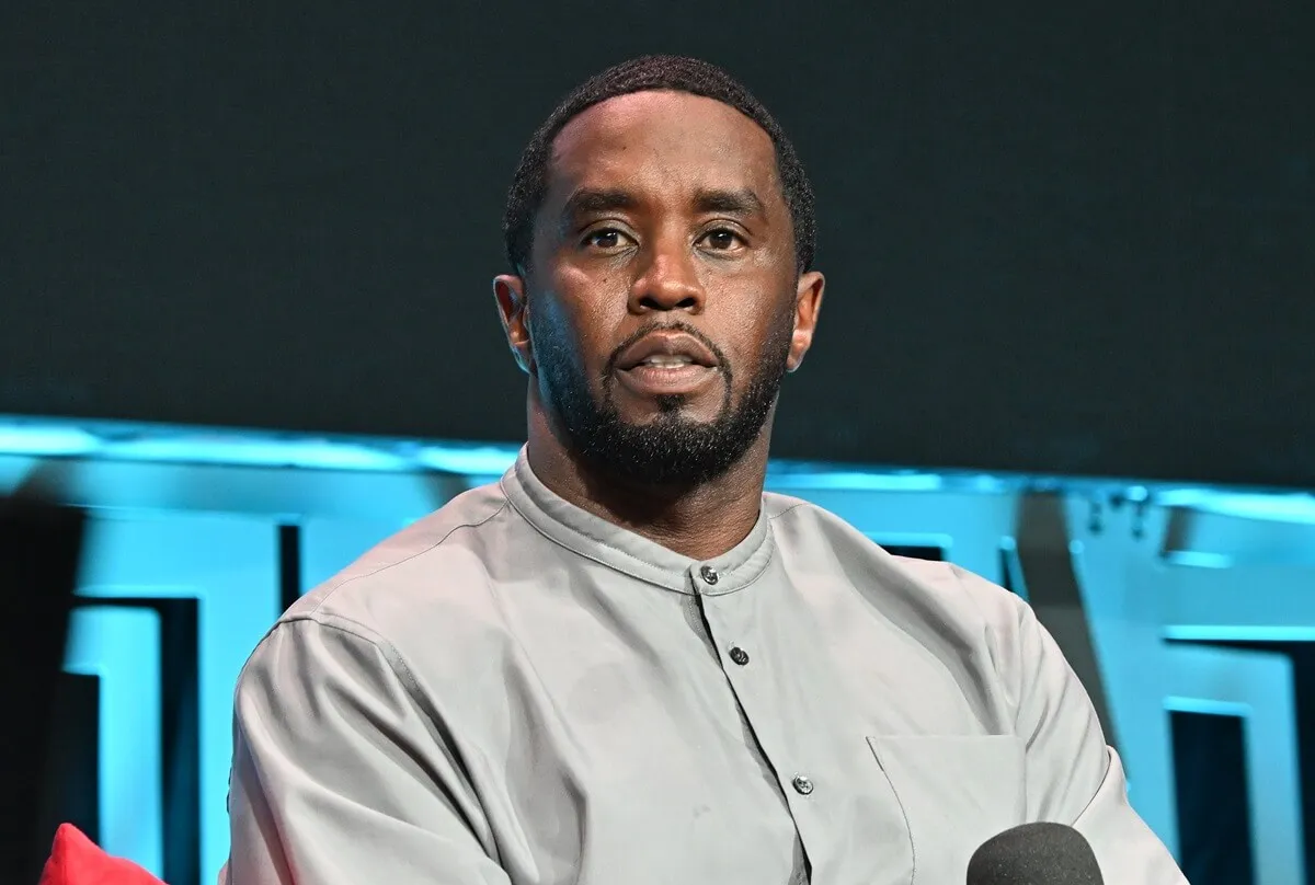 Sean 'Diddy' Combs sitting down while wearing a grey shirt at the Day 1 of 2023 Invest Fest at Georgia World Congress Center.