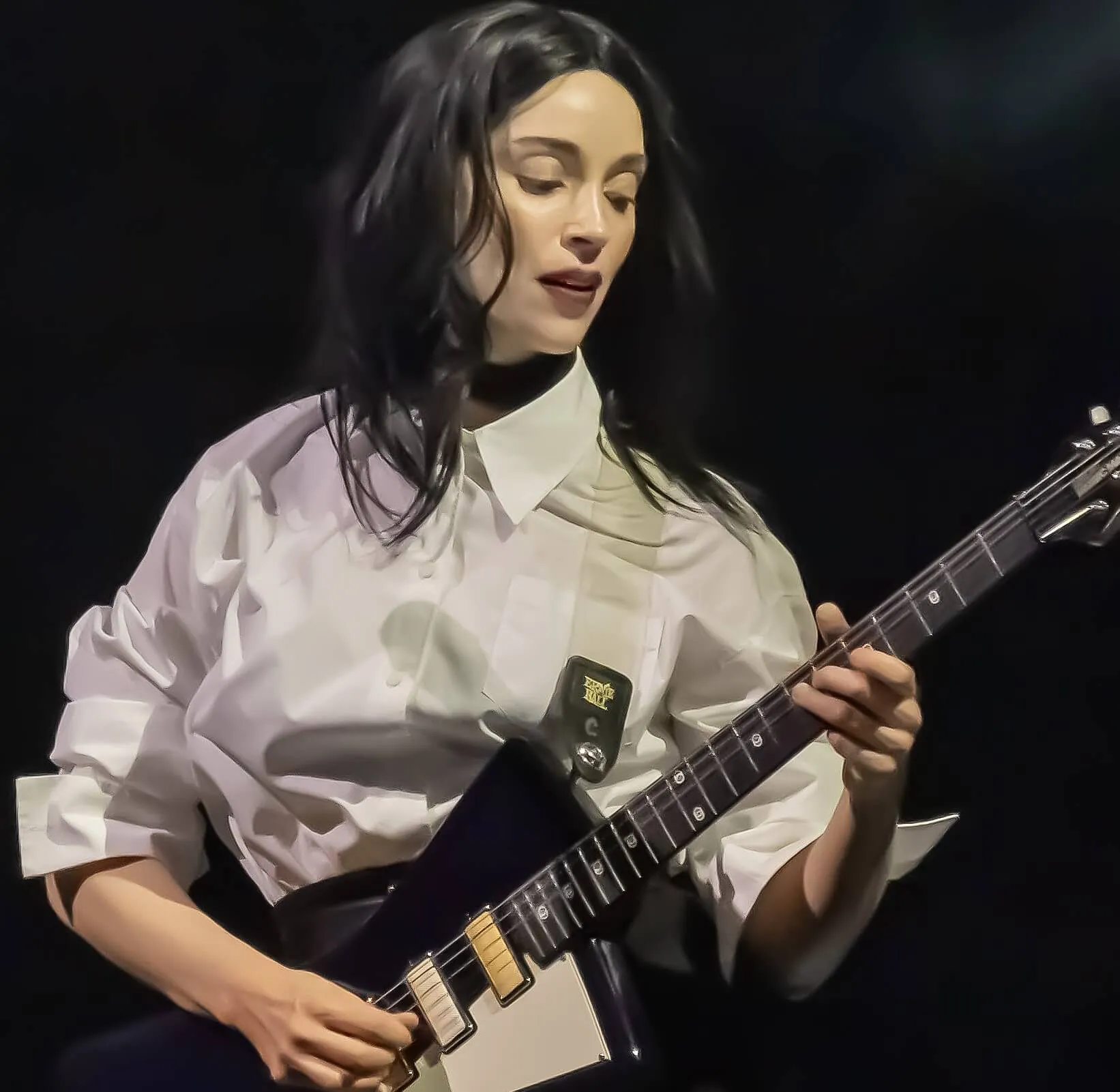 "Big Time Nothing" singer St. Vincent with a guitar