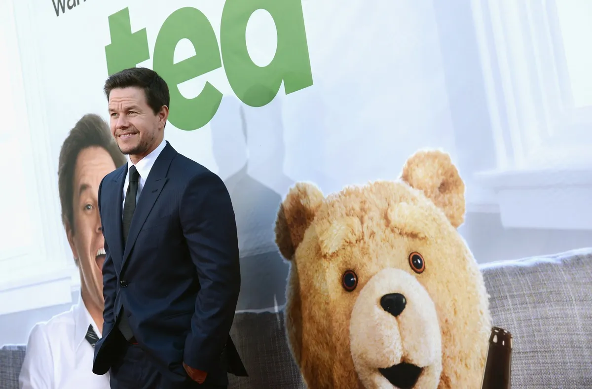 Mark Wahlberg posing at the premiere of 'Ted' in a suit.