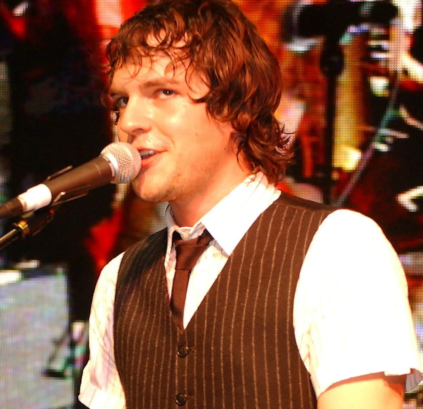 The Killers' Brandon Flowers with a microphone