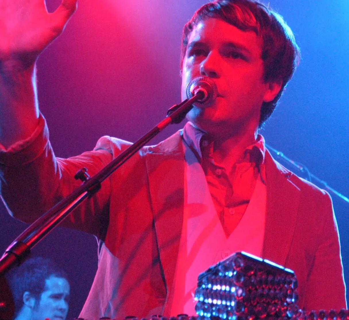 The Killers' Brandon Flowers raising his hand