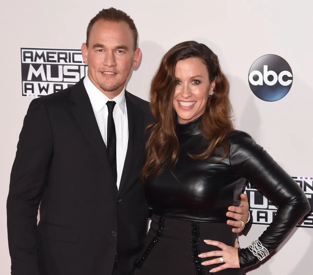 Alanis Morissette and her husband, Mario Treadway arrive at the American Music Awards