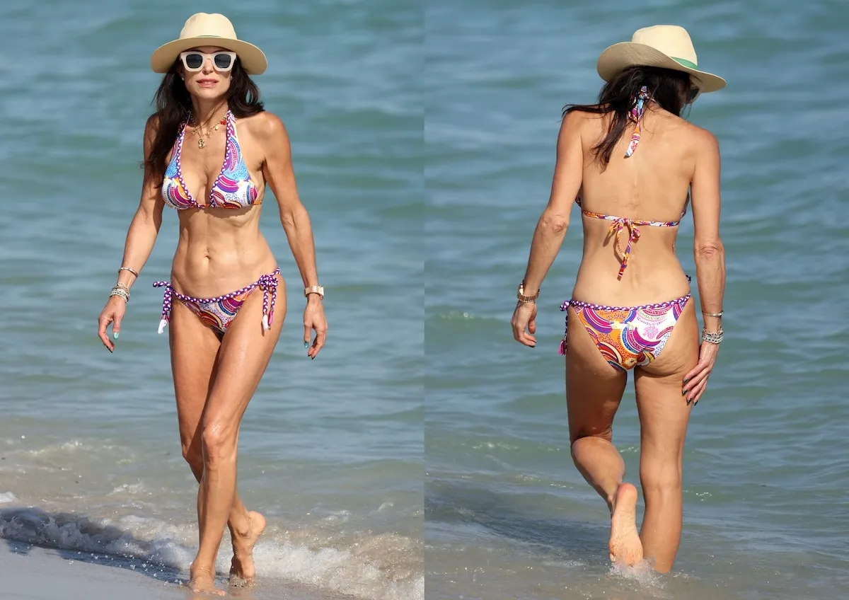 Wearing a pink and blue floral bikini, Bethanny Frankel walks on a Miami beach