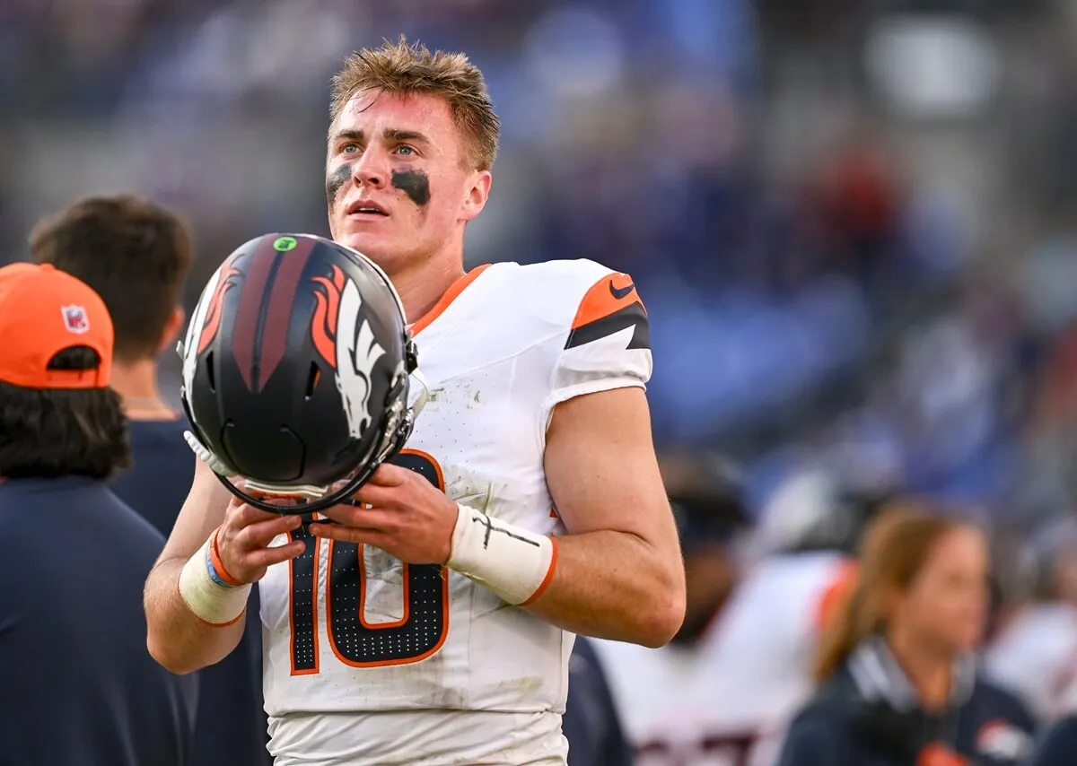 Bo Nix of the Denver Broncos prepares to take the field against the Baltimore Ravens