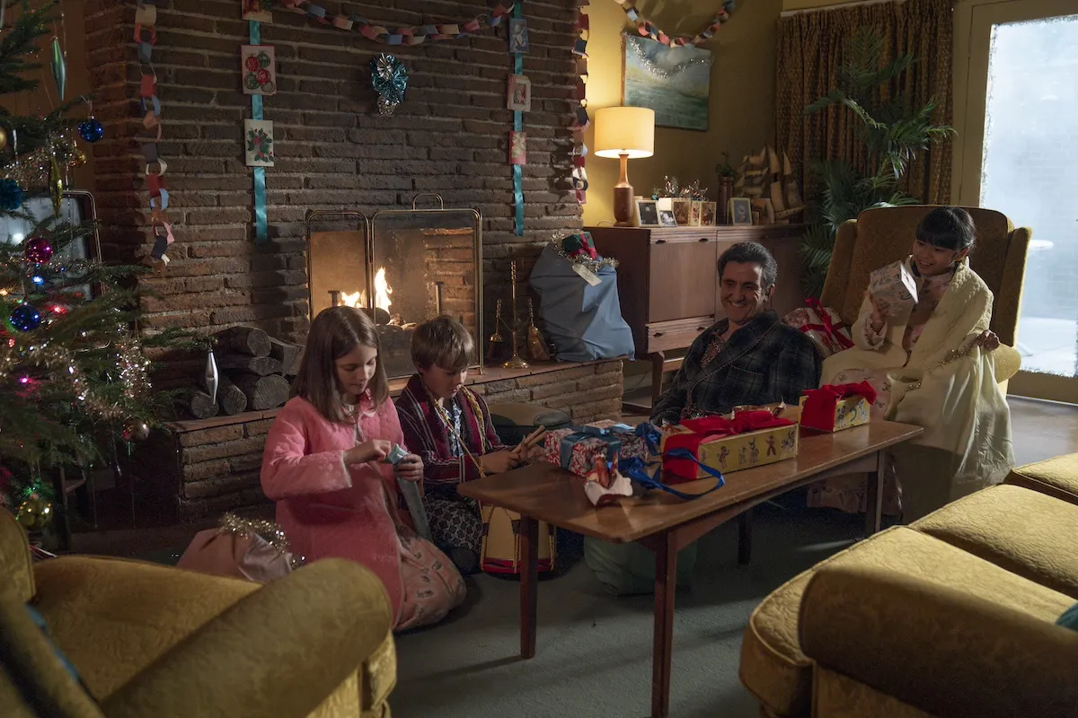 Family gathered in a 1960s living room at Christmas in 'Call the Midwife'