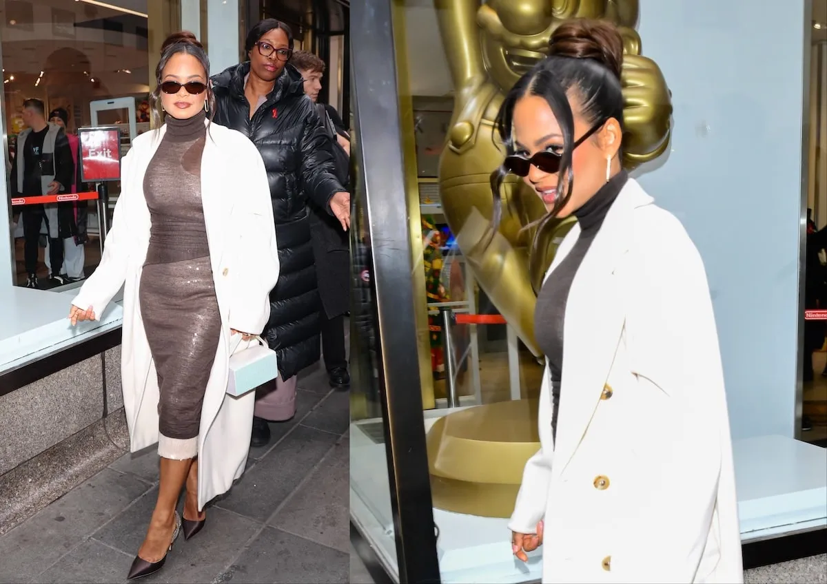 Wearing a black dress and white coat, Christina Milian dodges the paparazzi in NYC in 2024