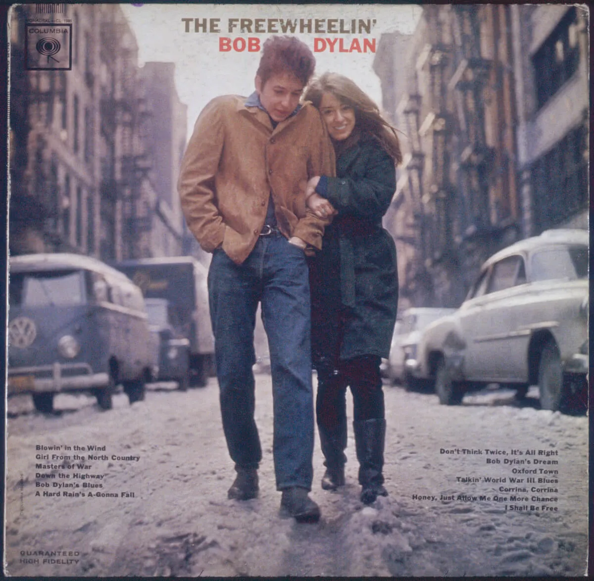 Bob Dylan and Suze Rotolo walk through a street on the cover of 'The Freewheelin' Bob Dylan'.