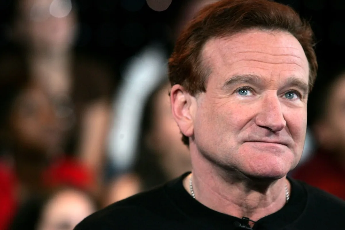 Robin Williams posing onstage during MTV's Total Request Live.