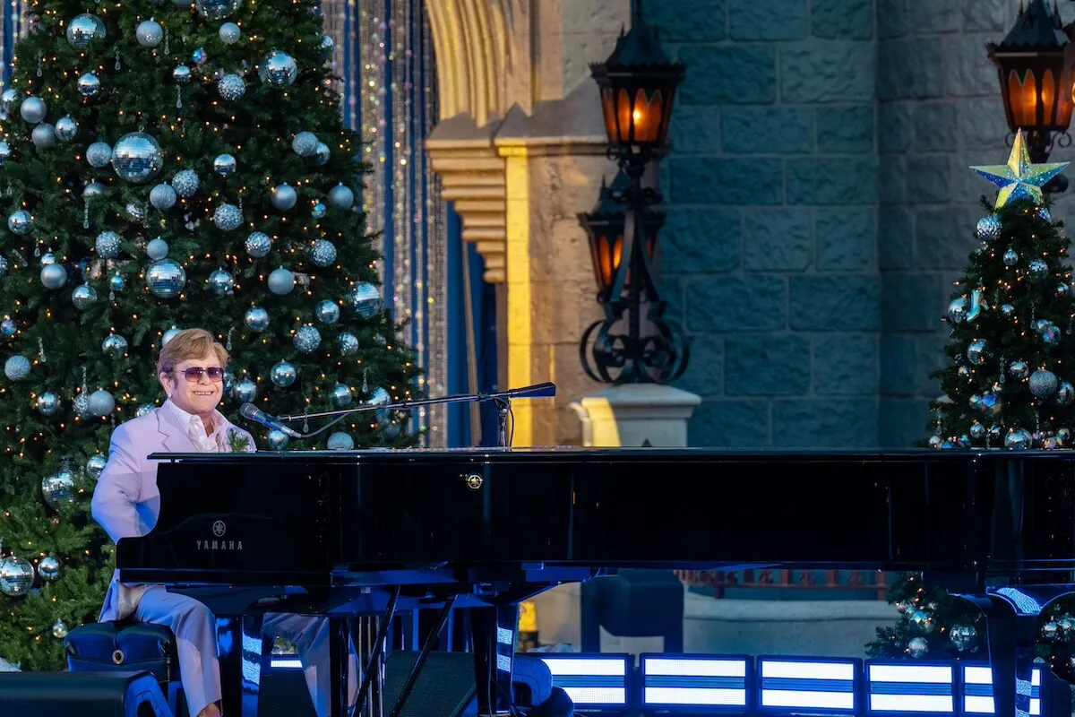 Elton John playing piano at the 2024 Disney Christmas Parade