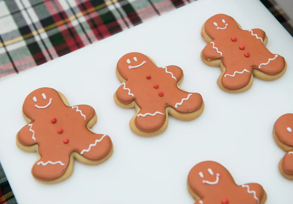 Gingerbread men cookies on white plate