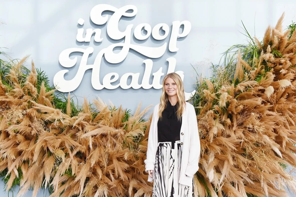 Gwyneth Paltrow attends the In goop Health Summit San Francisco 2019 while wearing a white sweater, white pants and a black shirt.