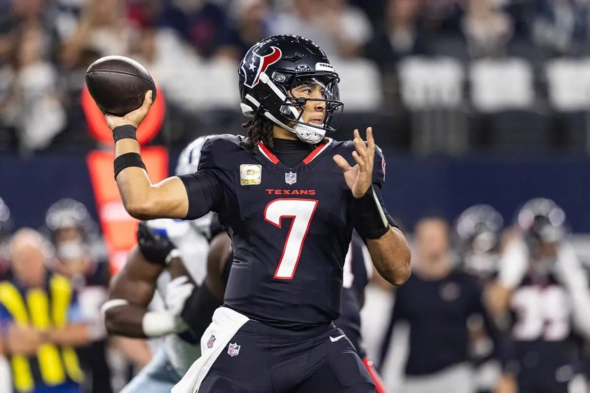 Houston Texans quarterback CJ Stroud throws a pass in the first quarter against the Dallas Cowboys at AT&T Stadium