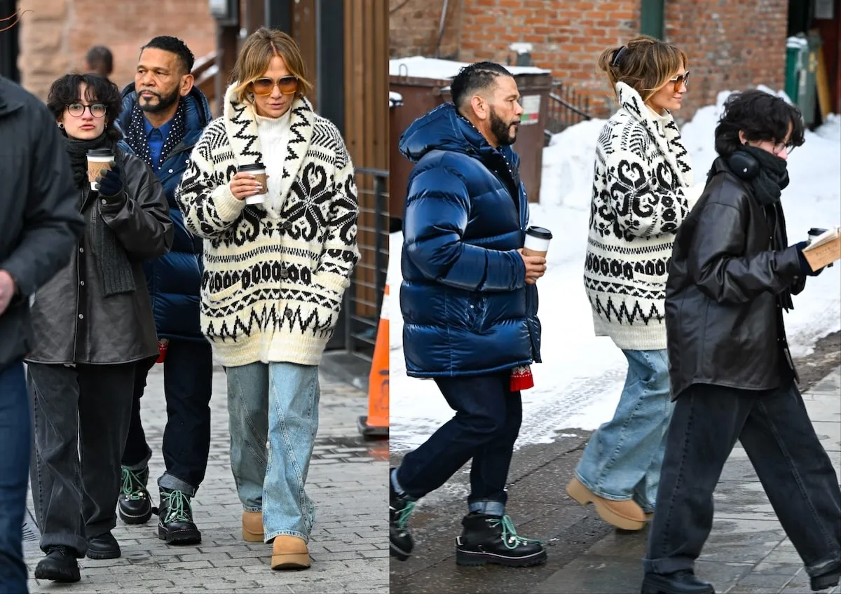 Wearing a black and white sweater, Jennifer Lopez walks an Aspen street with Benny Medina and Emme Muniz