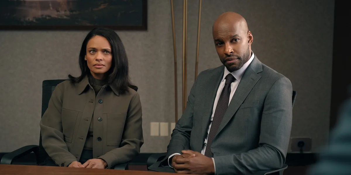 A Black woman and Black man, both in dark suits, in 'Virgin River' Season 6