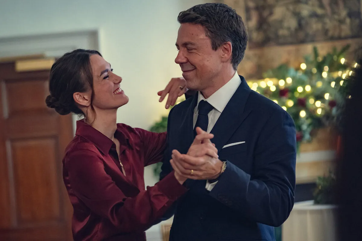 Keira Knightley and Andrew Buchan in 'Black Doves' Season 1, which is set at Christmas, dance.