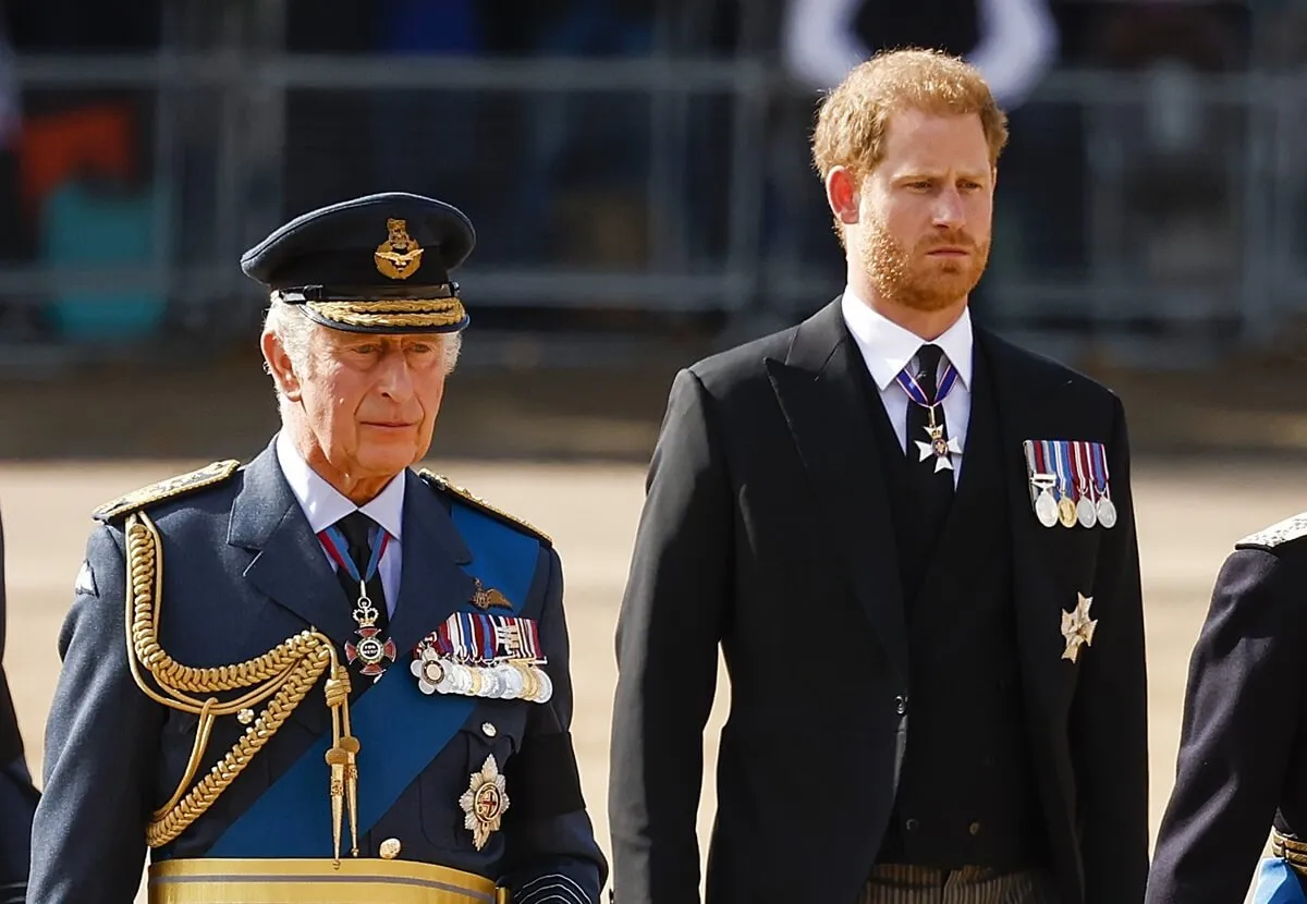 King Charles III and Prince Harry walk behind the coffin during the procession for the Lying-in State of Queen Elizabeth II