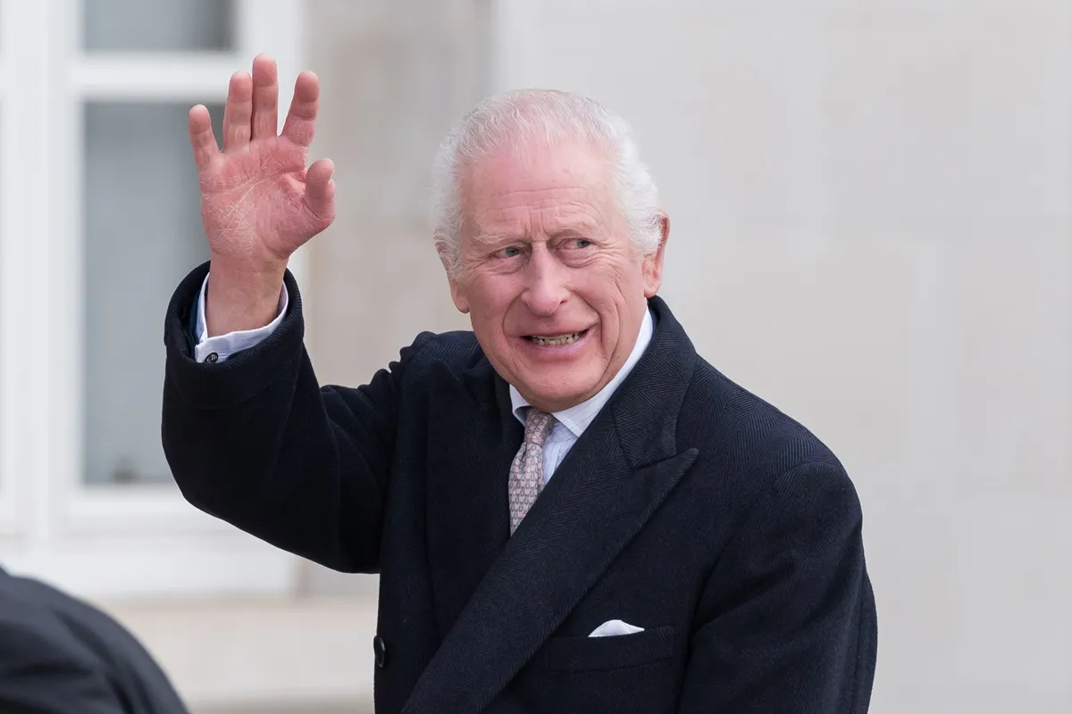 King Charles III waves towards well-wishers as he arrives to attend a reception at Waltham Forest Town Hall in London