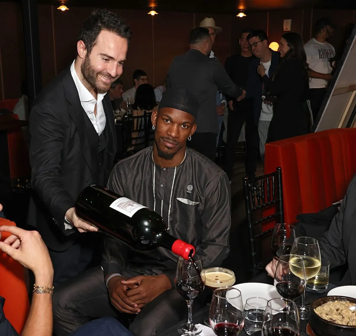 Large bottle of wine being poured for Jimmy Butler at the Haute Living magazine Jimmy Butler celebration in Miami