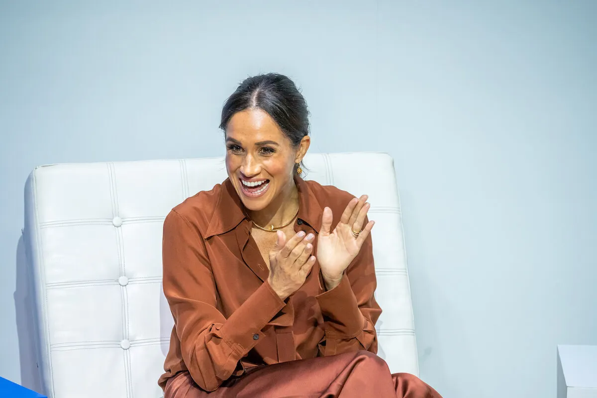 Meghan Markle, who is reportedly the new CEO of American Riviera Orchard, claps