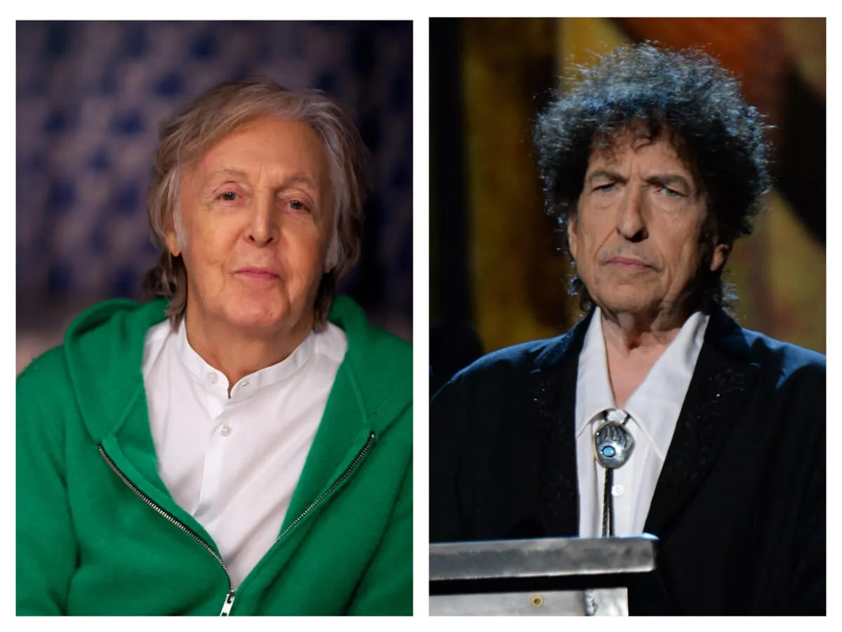 Paul McCartney wears a white shirt and green hoodie. Bob Dylan wears a suit and bolo tie.