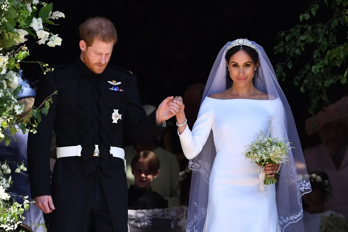 Prince Harry and Meghan Markle emerge from the West Door of St. George's Chapel at Windsor Castle